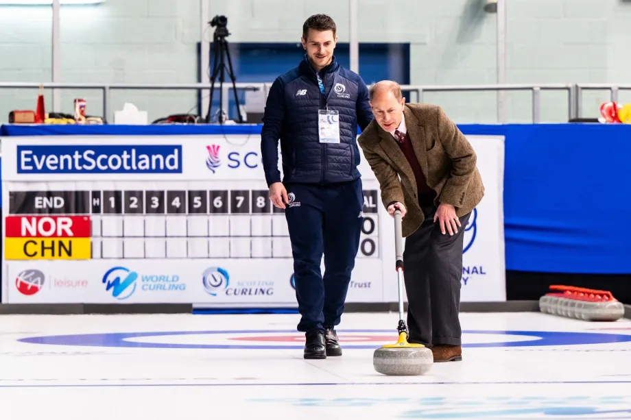 The Duke of Edinburgh throwing a curling stone