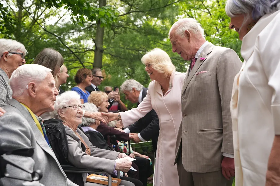 The King and Queen meet people during a tree planting at Rideau Hall