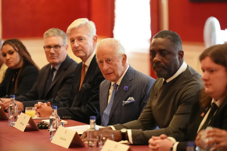 Prime Minister Sir Keir Starmer, Sir Clive Alderton, The King and Idris Elba listen to discussions at St James's Palace