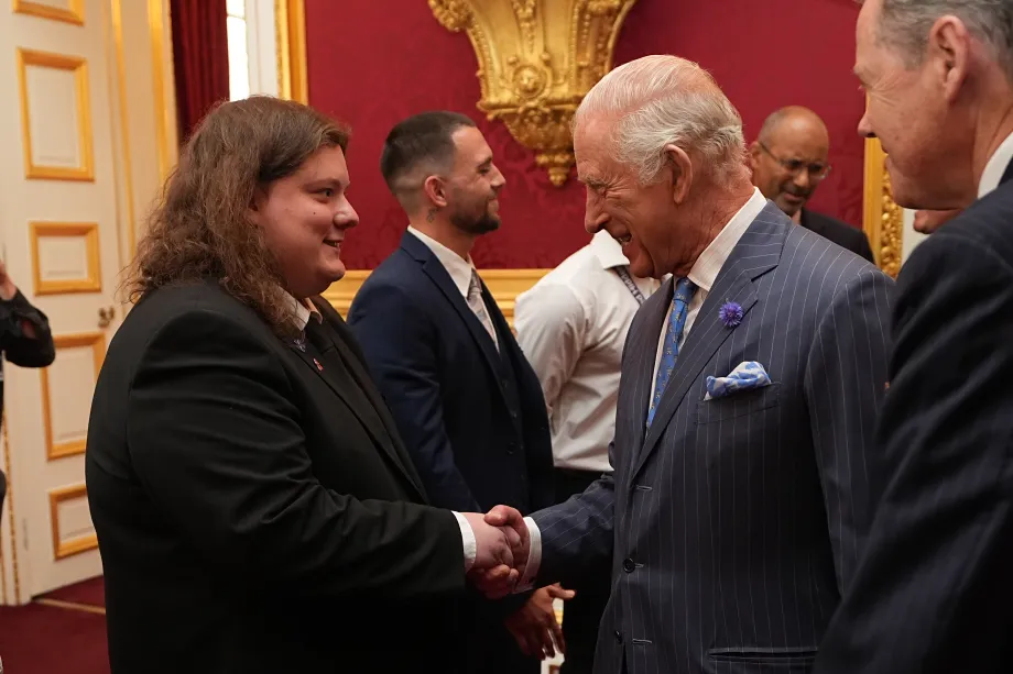 The King shakes hands with Matthew Wane from The King's Trust