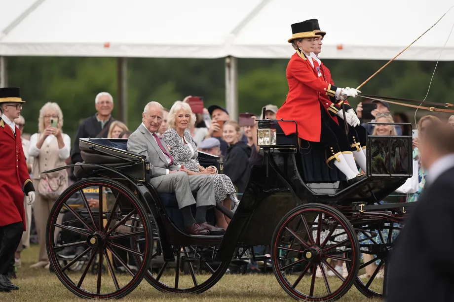 The King and Queen arrive by carriage at the Sandringham Flower Show