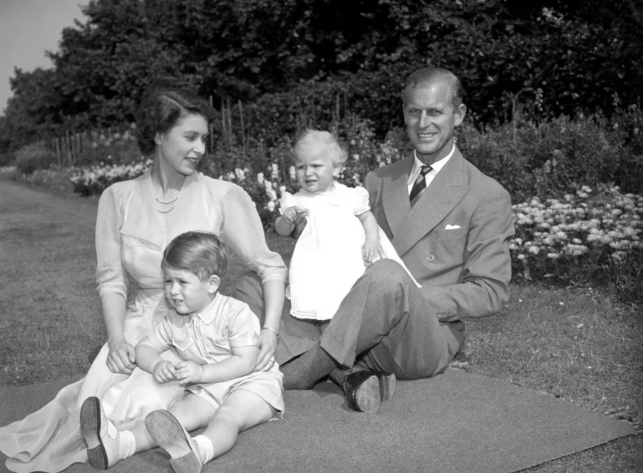 Princess Anne with her father, The late Duke of Edinburgh, her mother, then Princess Elizabeth, and Prince Charles, in the grounds of Clarence House