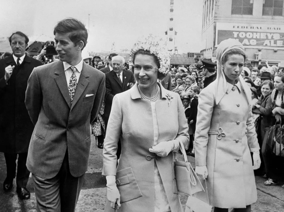 Queen Elizabeth II with Princess Anne and Prince Charles as they pass through the crowds at the Royal Easter Show in Sydney