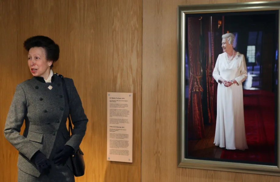 The Princess Royal unveils a portrait of Britain's Queen Elizabeth II by Shaun Murawski at the Scottish parliament in Edinburgh.