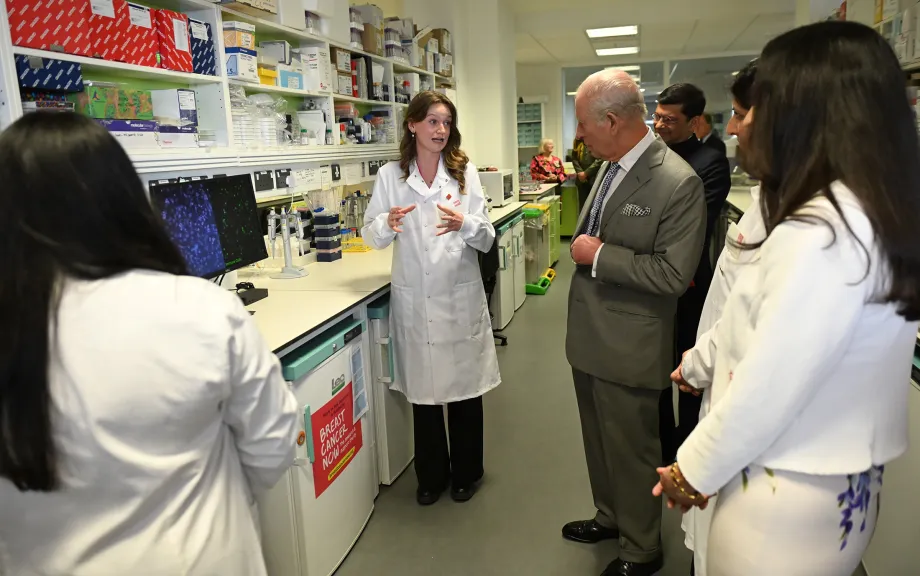 The King speaks to members of staff