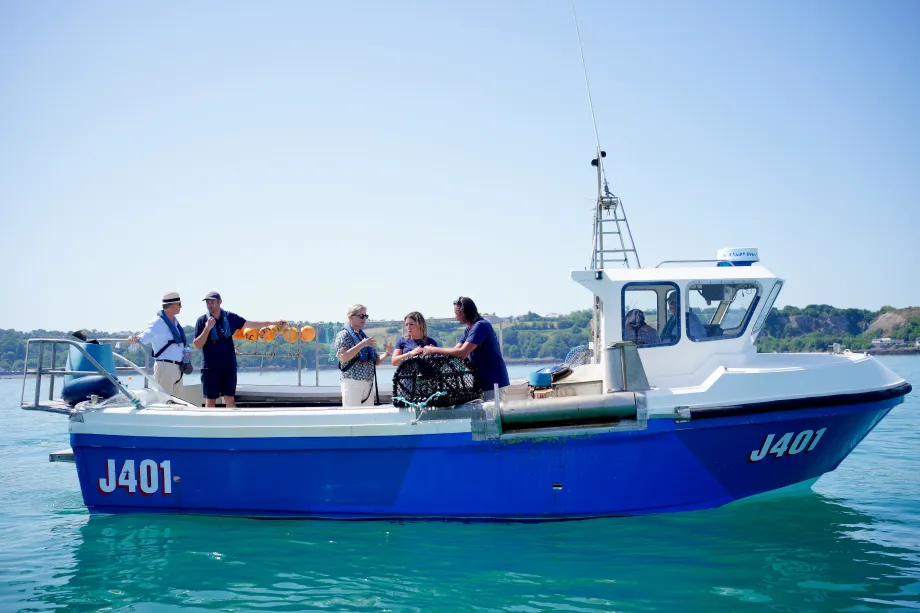 The Duchess of Edinburgh on board a fishing boat at St Catherine's Breakwater