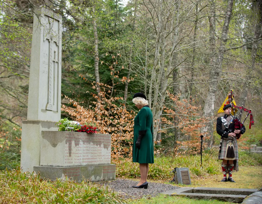 The Duchess of Cornwall lays flowers at the Balmoral War Memorial on VE Day