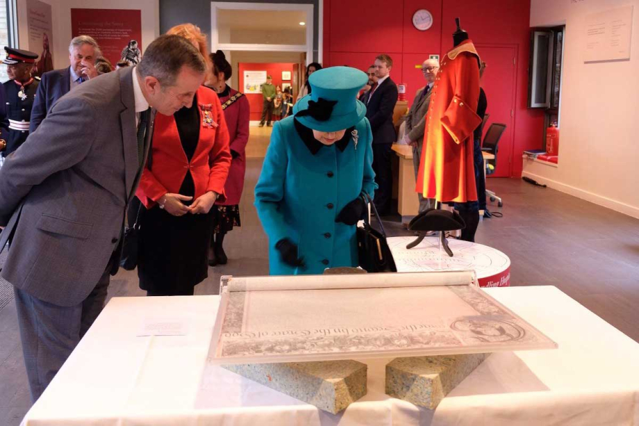 The Queen views the Charter at the opening of the Queen Elizabeth II Centre 
