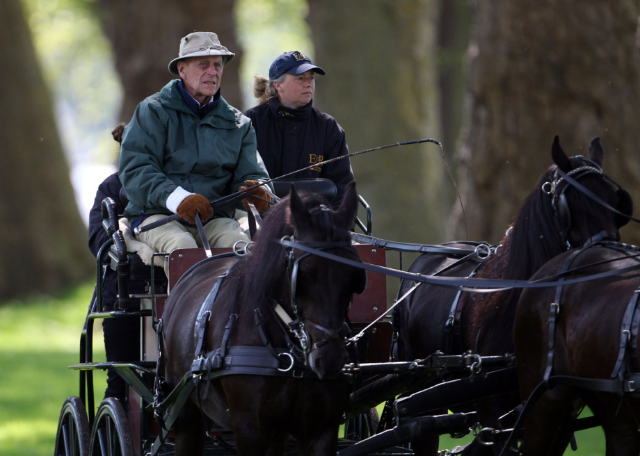 The Duke of Edinburgh drives a carriage at Windsor Castle