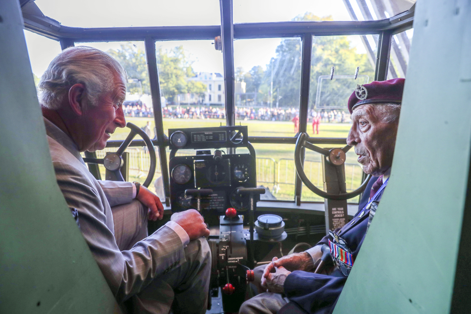 The Prince of Wales talks to gilder pilot Frank Ashleigh during a visit to Airborne Memorial, Airborne Museum Hartenstein
