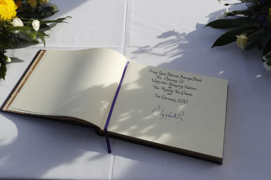 The Queen signs the visitors book at Wolferton Pumping Station 