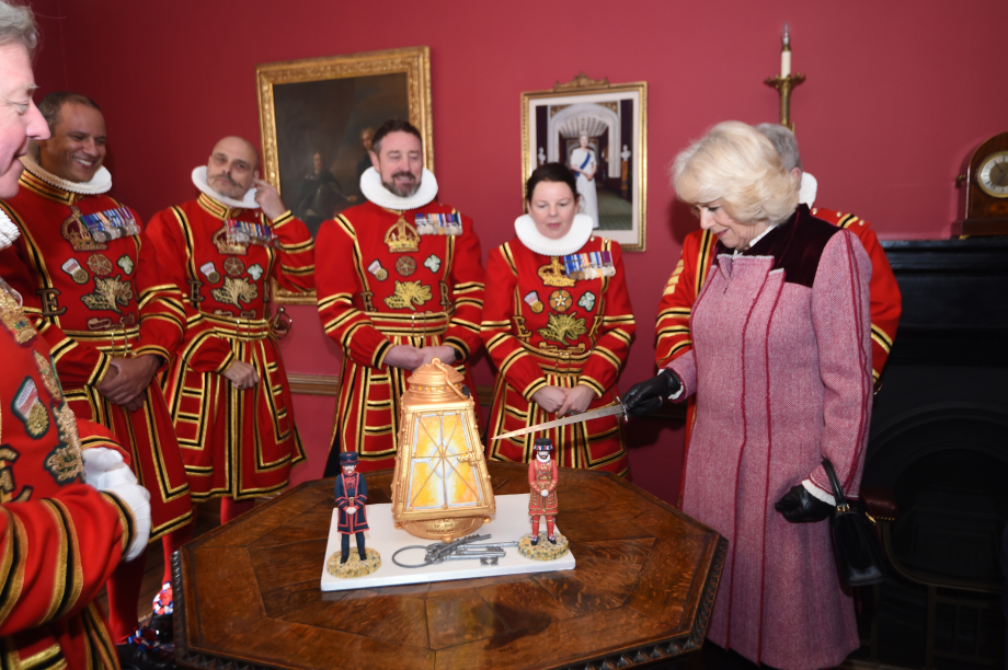 The Duchess of Cornwall cuts a cake at the Tower of London