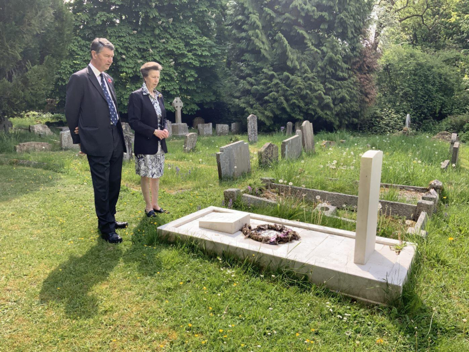 The Princess Royal and Admiral Sir Tim Laurence visit the grave of the Founder of the CWGC on VE Day