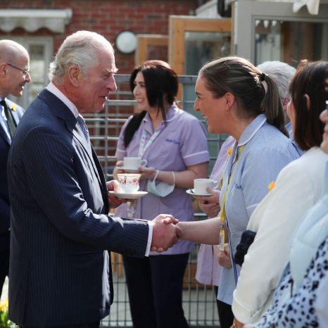 The Prince of Wales, patron of Marie Curie, meets staff during a visit to a Marie Curie Hospice in Belfast in 2022.