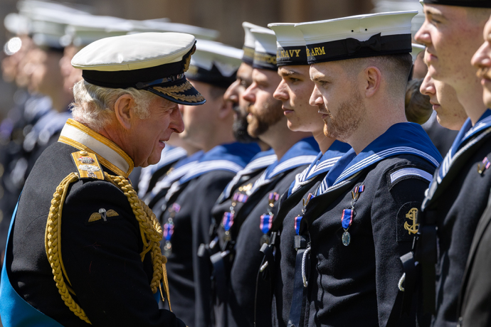 The King presents Royal Navy personnel with RVO medals