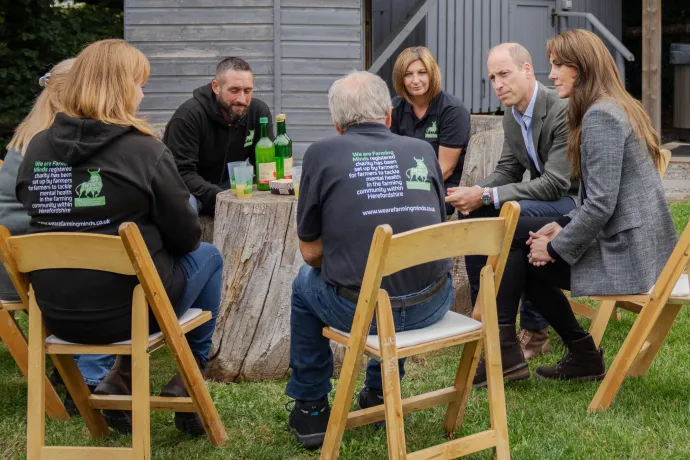 The Prince and Princess of Wales sitting around a table with We Are Farming Minds representatives
