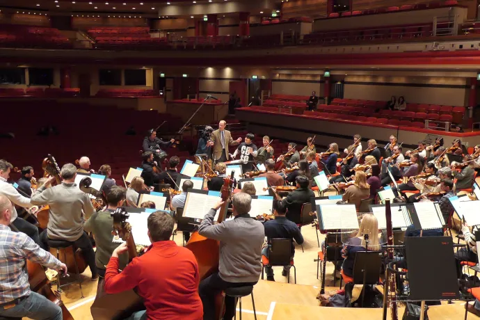 The Duke of Edinburgh conducting on stage