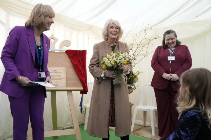 Queen Camilla smiles after unveiling a plaque during a visit to the Swindon Domestic Abuse Support Service's (SDASS) in Wiltshire, to mark the charity's 50th anniversary and highlight their work in support, prevention, education and early intervention, including work with perpetrators of domestic abuse.