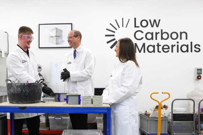The Prince of Wales visits Low Carbon Materials, pictured meeting staff in a lab coat and gloves