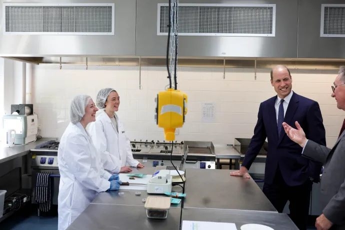 The Prince of Wales speaks with business owners in a lab at Cardiff Metropolitan University