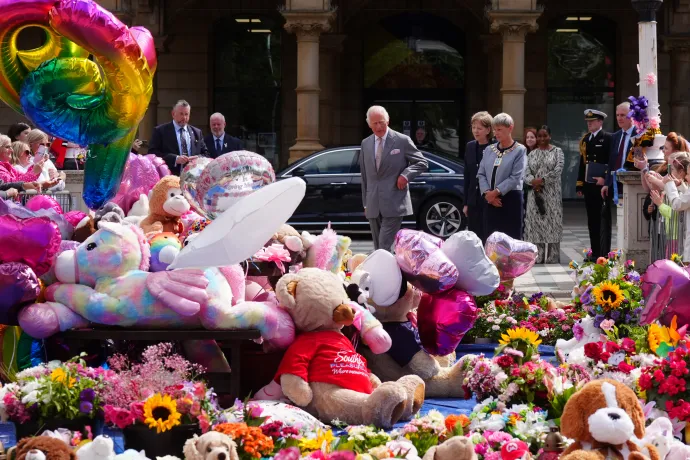 The King views floral tributes in Southport