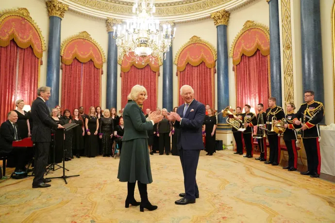 The Queen and King (L-R) applauding a performance by the MWC at Buckingham Palace