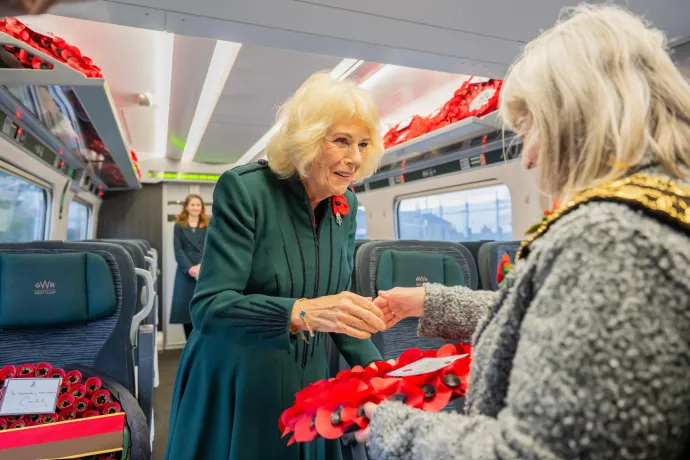 The Queen meets a member of the local community on the train at Chippenham