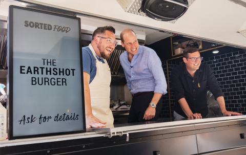 The Prince of Wales with Sorted Food co-founders Jamie (left) and Be (right) in a burger van