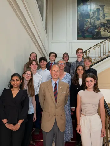 The Duke of Edinburgh smiles alongside IAF Gold Award students 