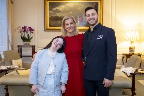 The Duchess of Edinburgh smiles alongside Ellie Goldstein and Vito Coppola