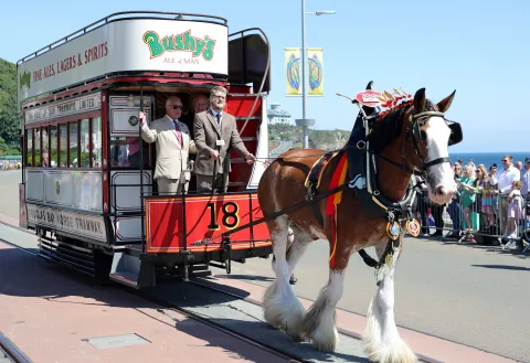 The King rides on one of the horse trams during a visit to Douglas Promenade